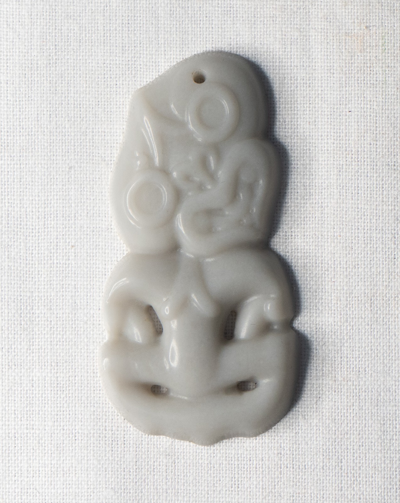White Hetian Jade Tiki Pendant -with Golden Era’s Guarantee of Authenticity.