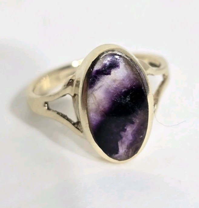 9ct Yellow gold open work ring. Collet set with an oval Blue John Cabochon.