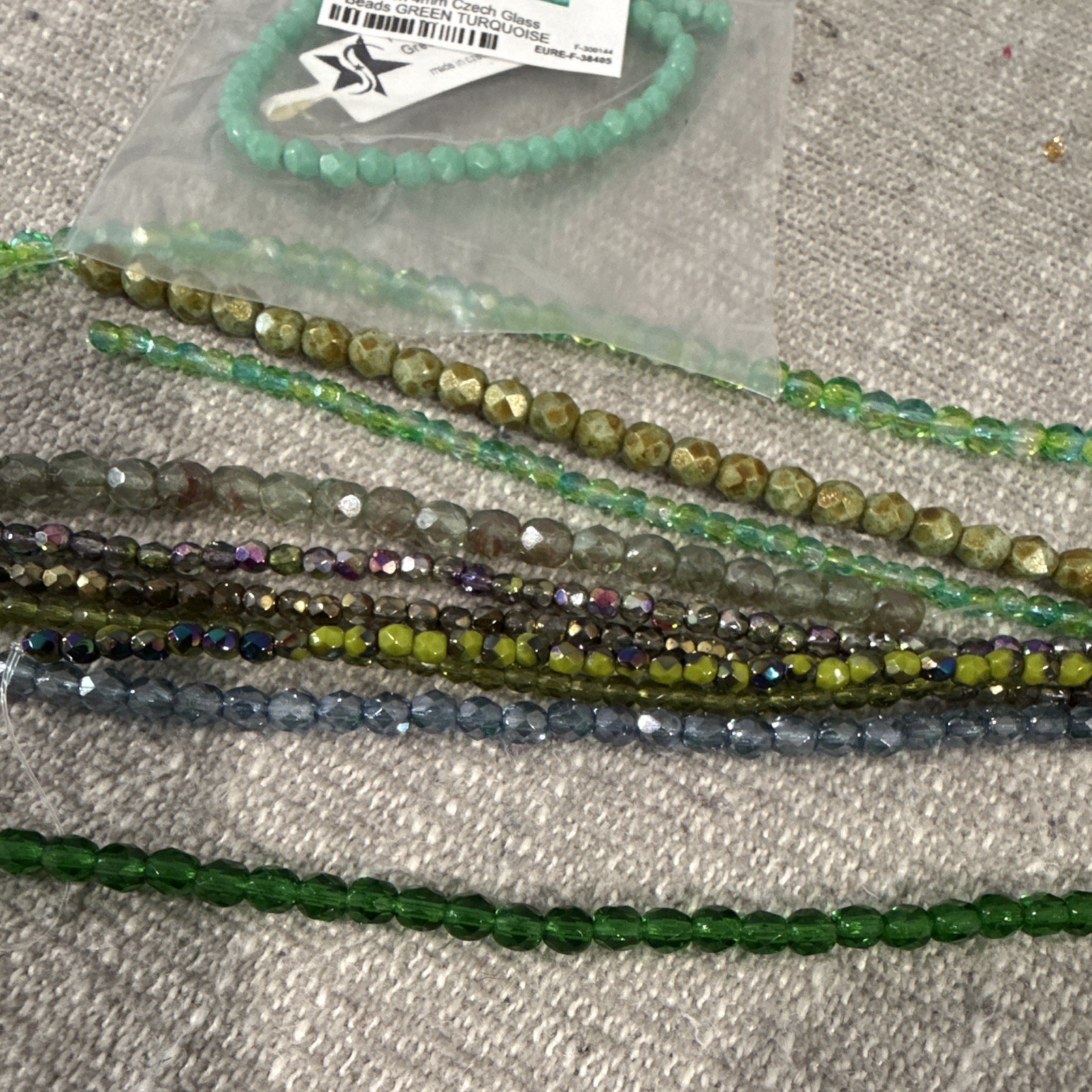 Czech fire polish beads and other strands, different sizes . Greens