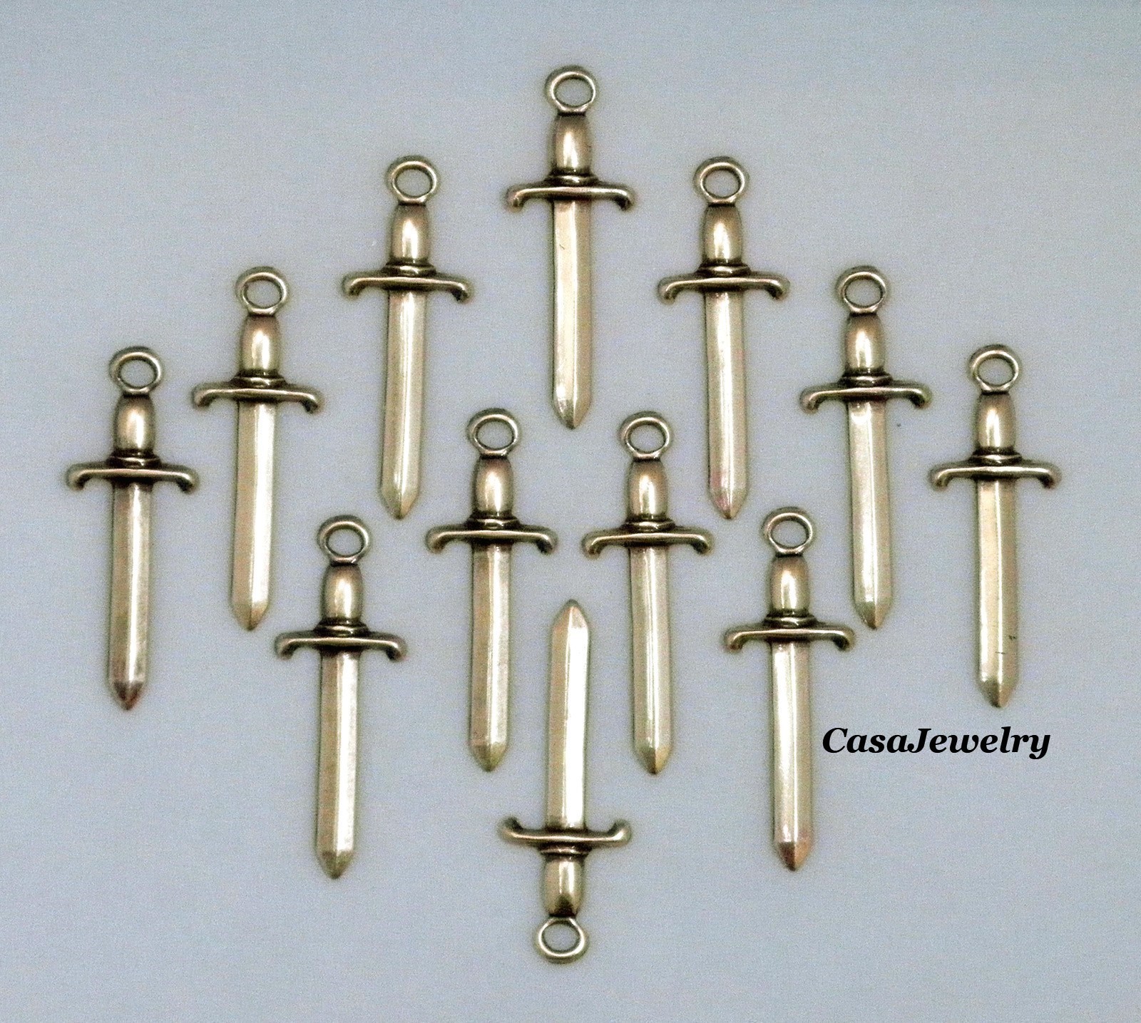 #0466 SMALL ANTIQUED GOLD SWORD W/TOP HANG RING – 12 Pc Lot
