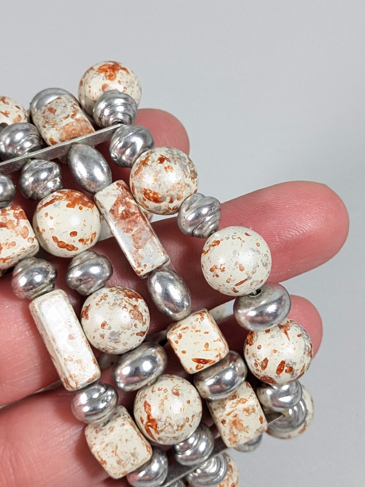 Silver Tone Ivory Color Brown Splatter Four Row Wide Stretch Bracelet 6 inches