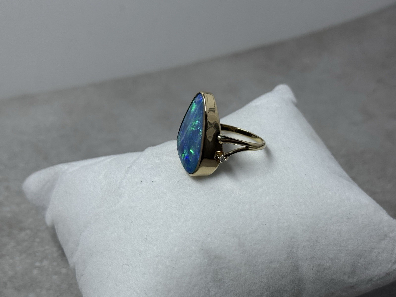 Natural Australian boulder opal with A 14k Gold ring And Diamonds. Ring size 8.