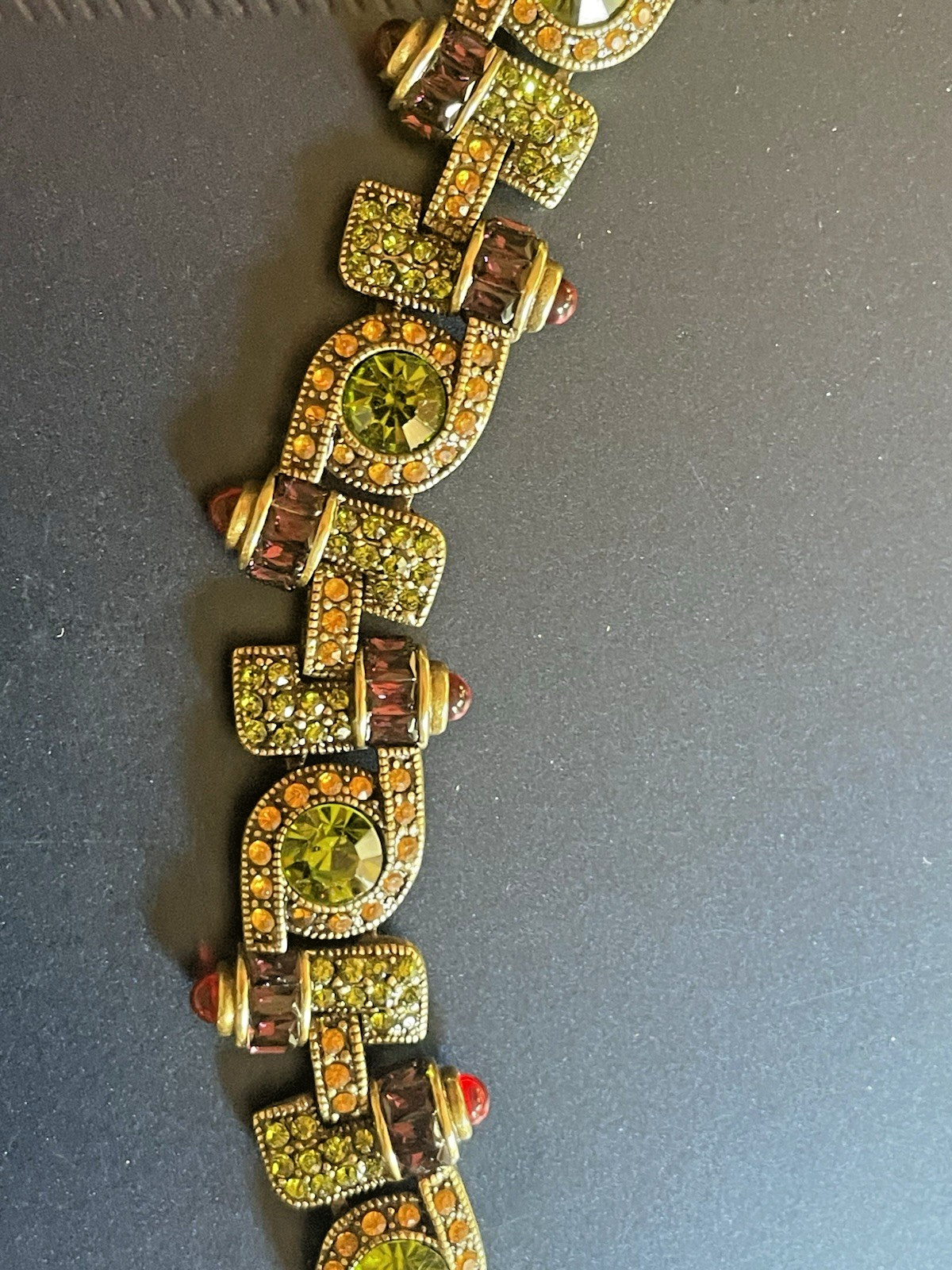 New Heidi Daus Bracelet in Original Packing. Olive Green, Red, Yellow Crystals.