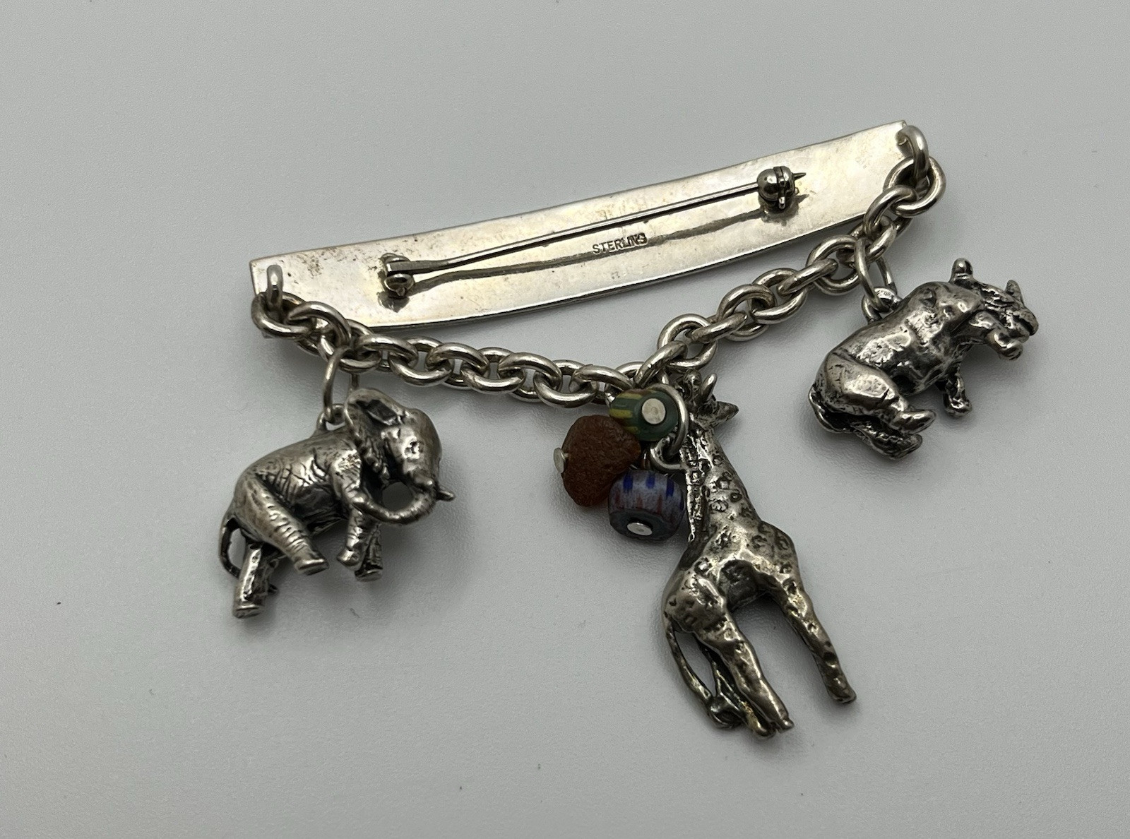 Vintage SUSAN CUMMINGs Safari Theme Sterling Silver Brooch/ Pin with charms!