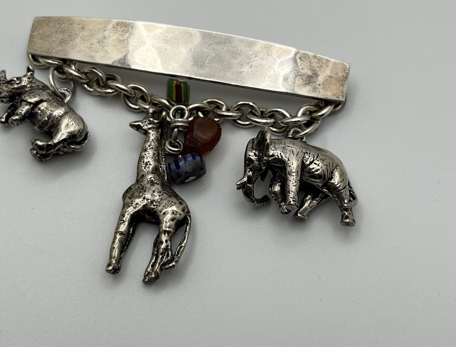 Vintage SUSAN CUMMINGs Safari Theme Sterling Silver Brooch/ Pin with charms!