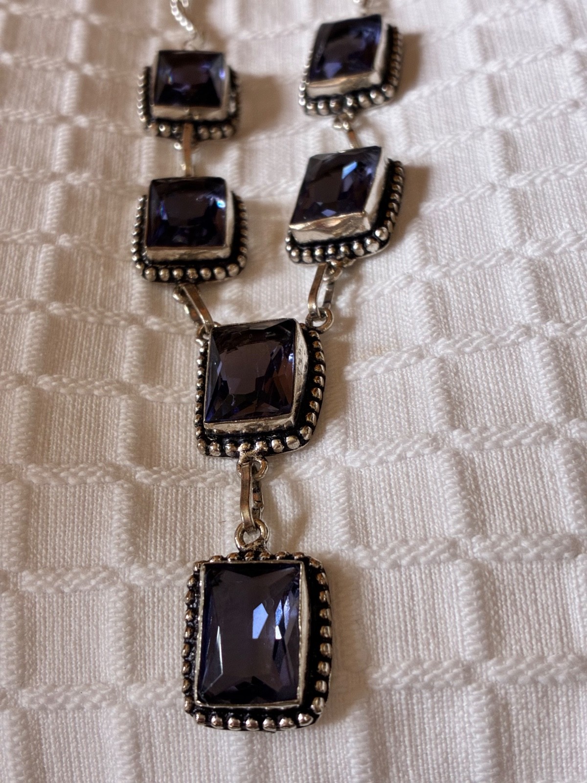 Dramatic large purple glass stones set in silver neckla