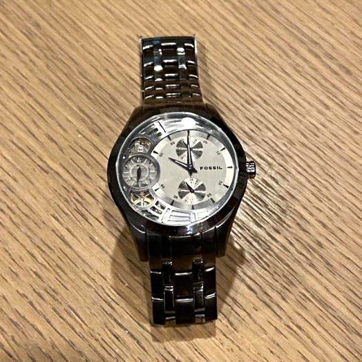 Fossil Twist Men’s Automatic Semi-Skeleton Silver Dial Black Steel 44mm 50m