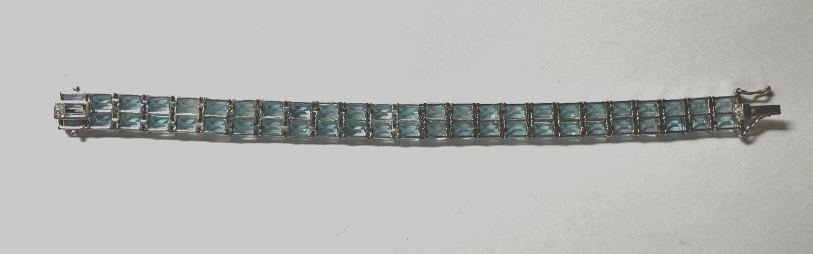 8” TENNIS BRACELET -ADI 925 STERLING SILVER – 40 EMERALD CUT TOPAZ STONES -NICE!
