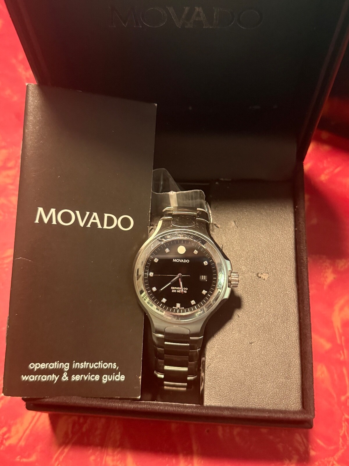 MOVADO 800 SERIES WATCH WITH BLCK BEZEL AND DIAMOND MAKERS – MENS WATCH