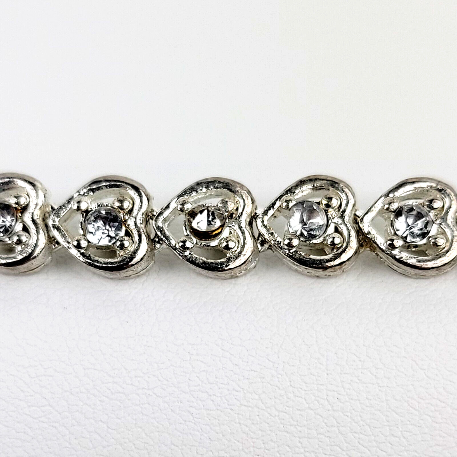 Heart Shaped Tennis Bracelet Silver Tone Link with Rhinestones Fold Over Clasp