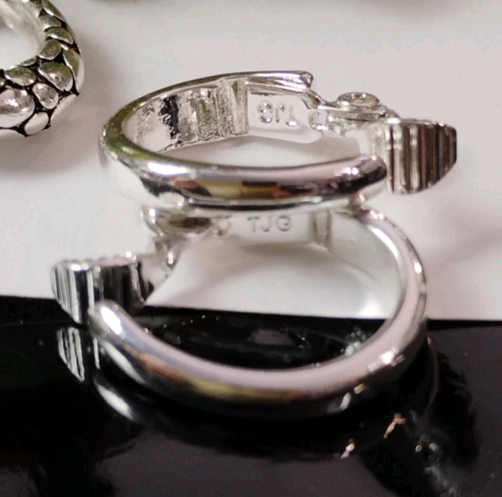 The JEWELRY GROUP TJG Set of THREE (3) Silver Toned Hoop Clip On Earrings!