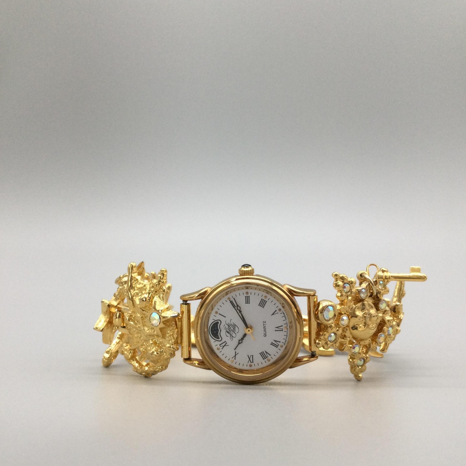 Kirks Folly K46Y Womens Watch 24mm Gold Tone Moon Phase Charms New Battery 8.5″