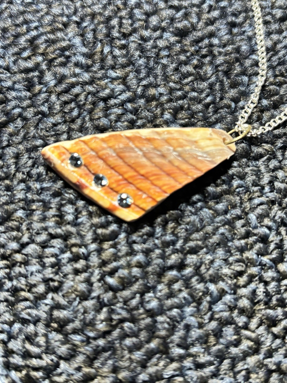 Shell Pendant Necklace. 30” silver bead chain. 3 one fifth carat blue diamonds.