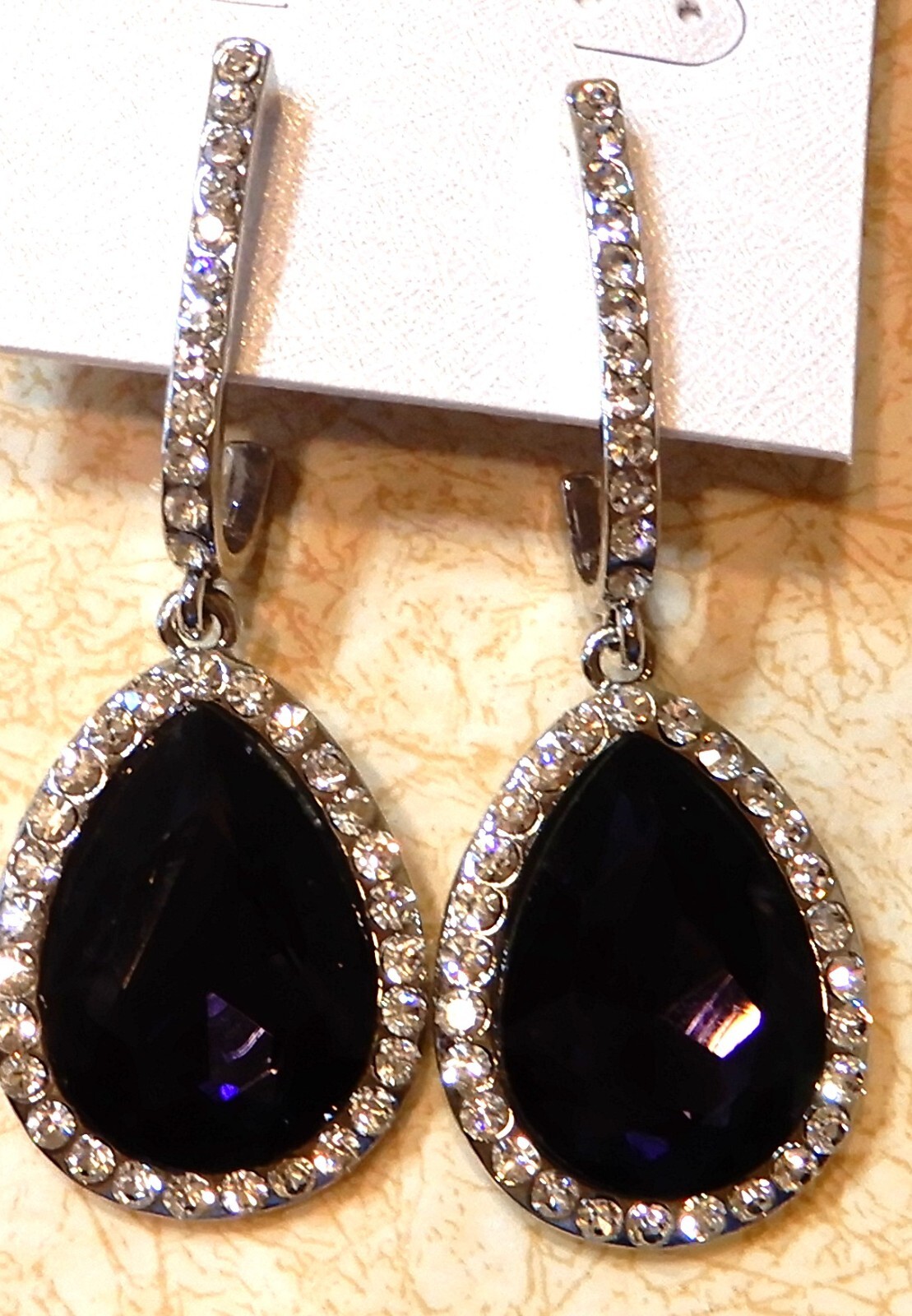 earrings – purple surrounded by rhinestones 2 1/2 inches