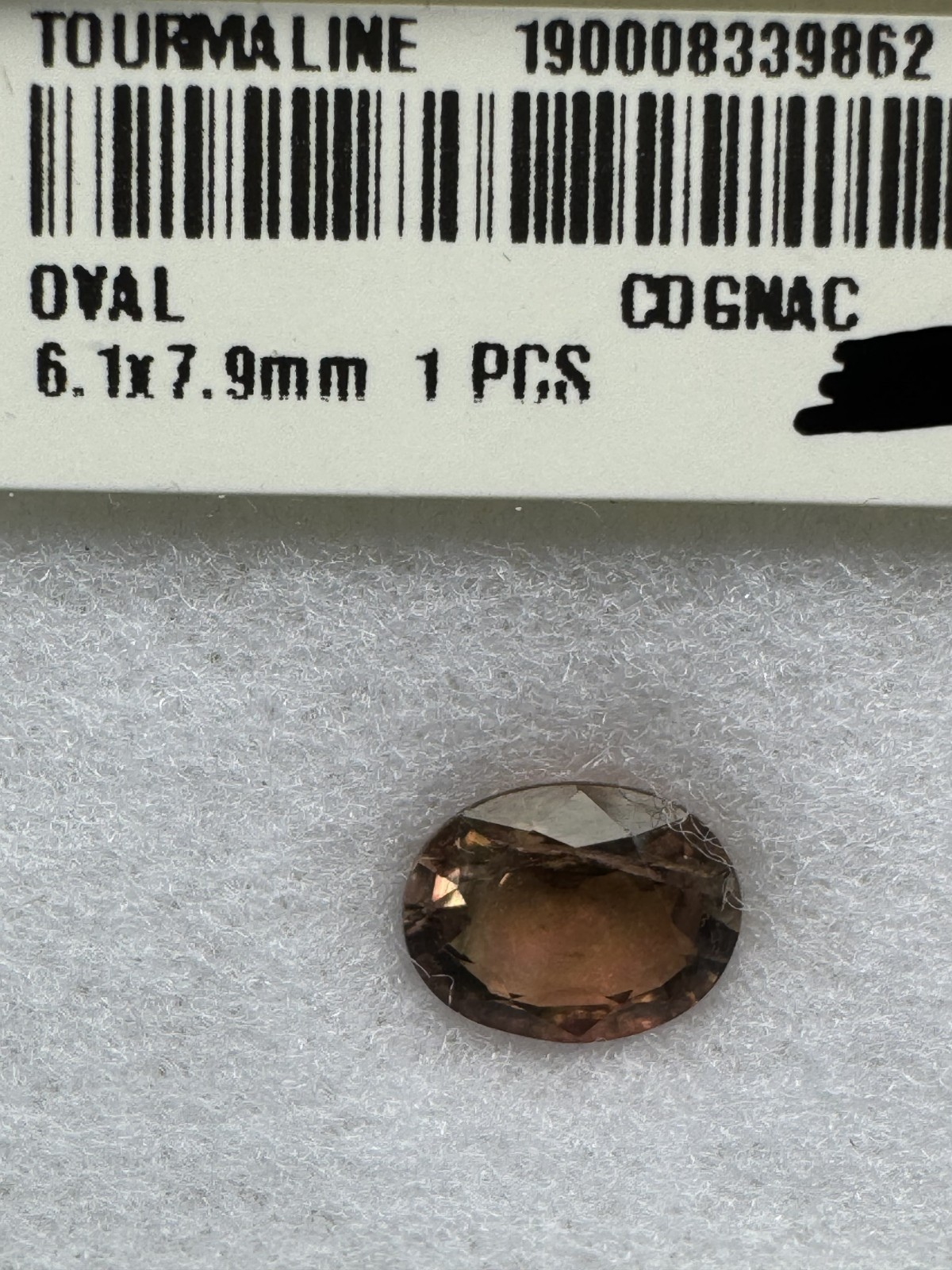 TOURMALINE. Cognac Oval, Very Slight Inclusion. 7.9 X 6.1 mm, 1.27 Carats.