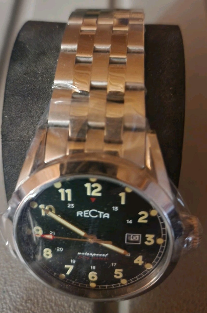 Recta mens watch has stainless bezel and band. Very classy