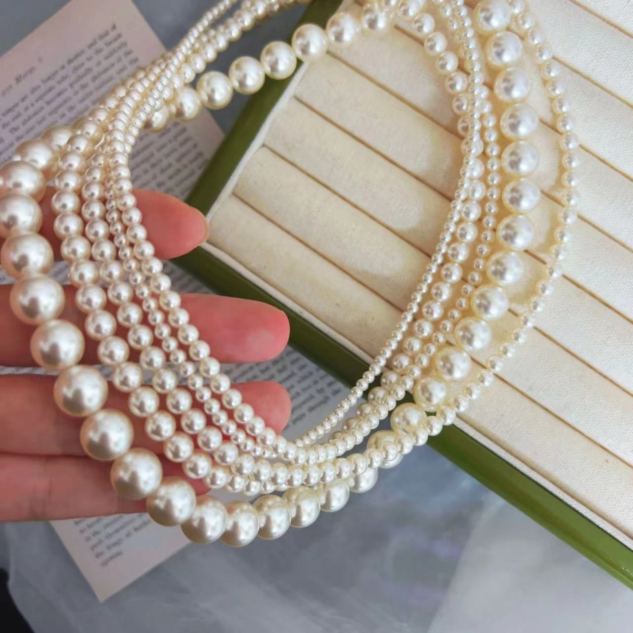 650 Warm White Perfectly Round High-Intensity Pearl Necklace