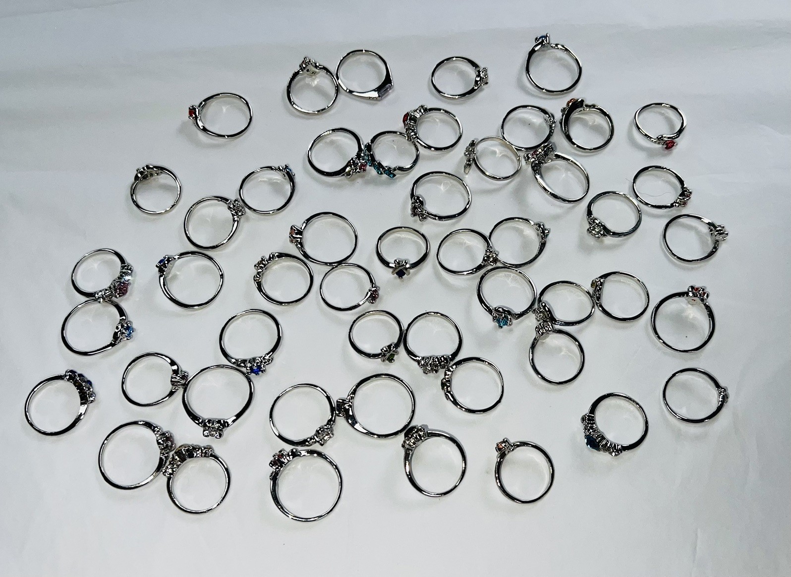 Bundle Of 50 Lovely Silver Coloured Rhinestone RINGS Single & Multiple Gem Stone