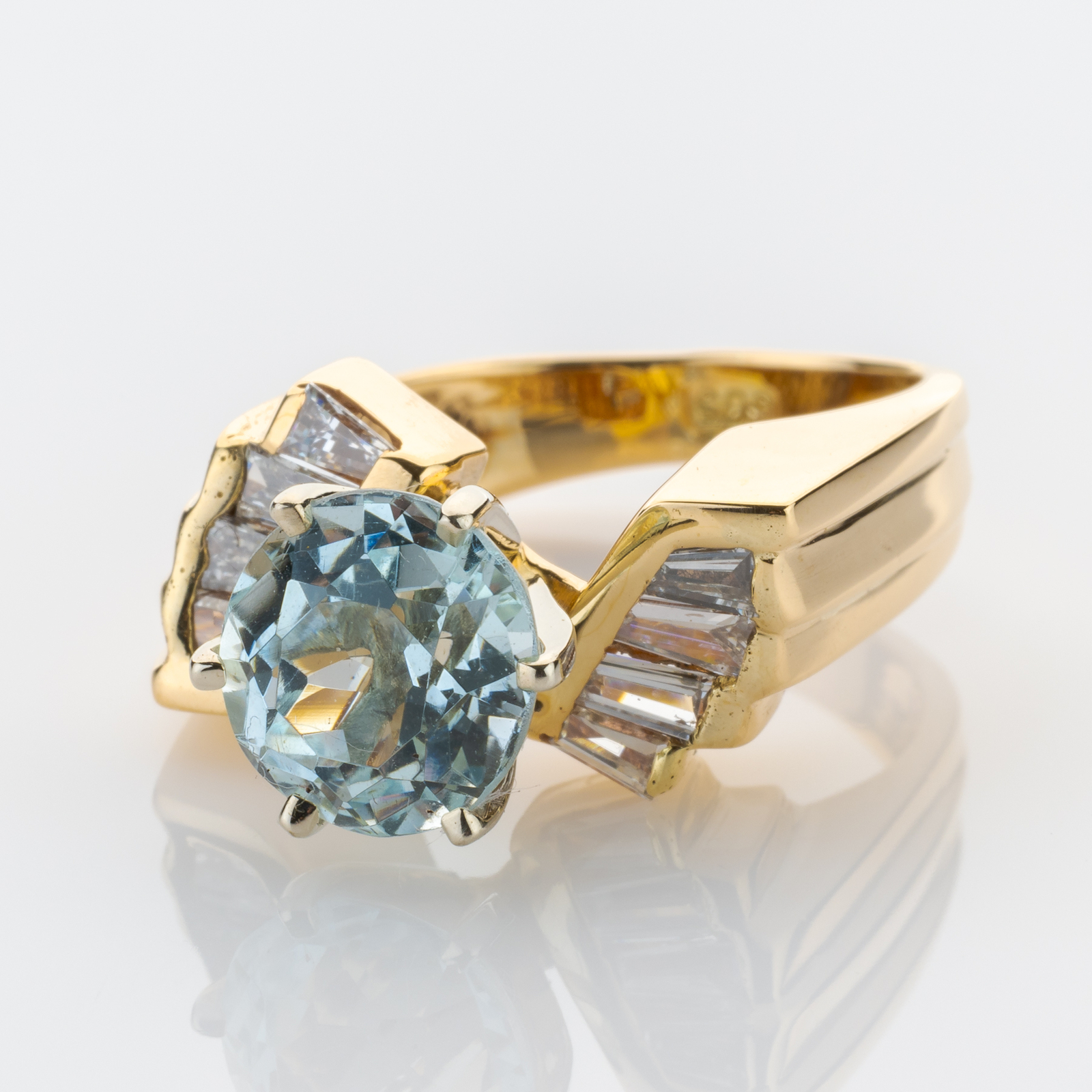 14k gold ring with an aquamarine and diamonds