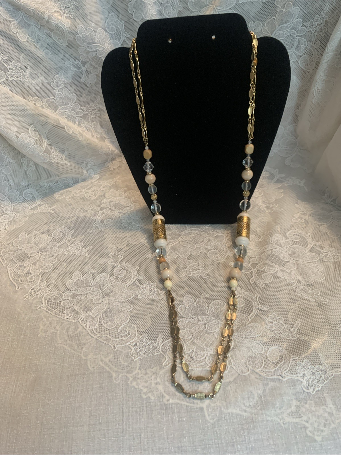 1928 Shiny Gold Tone 36″ Double Chain Necklace Clear, Beige, Gold, Wood Beads