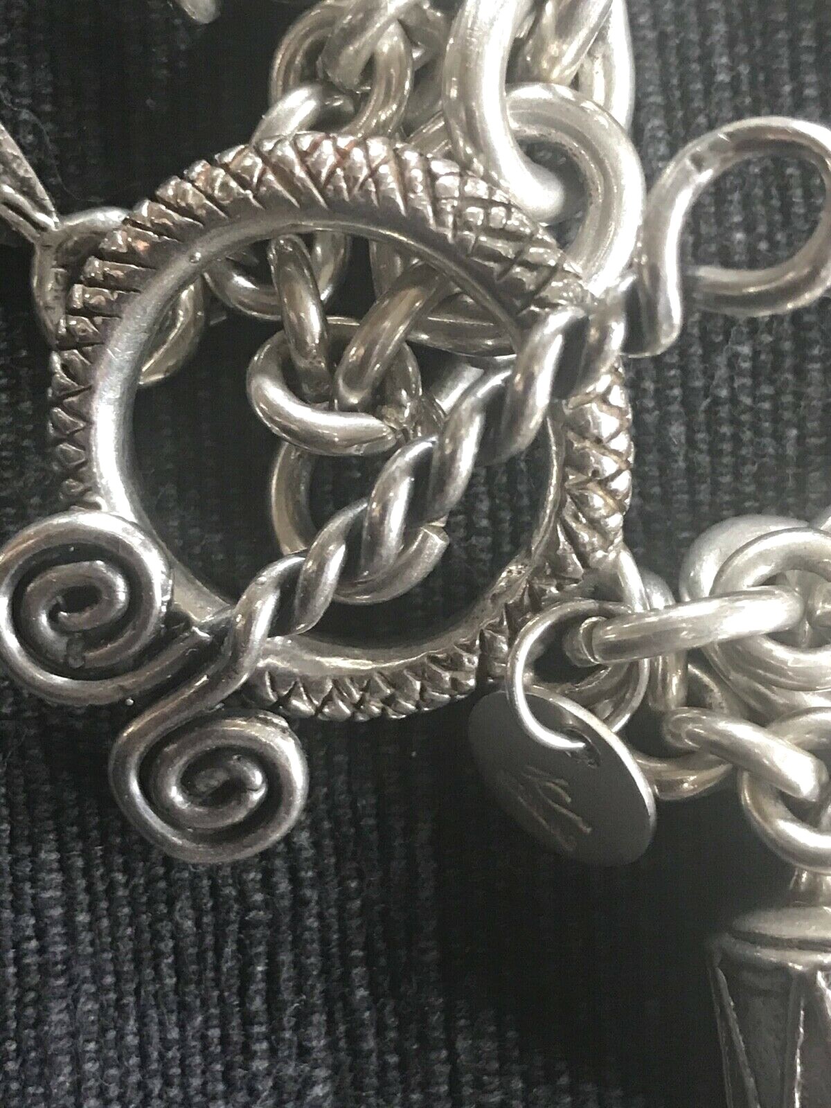 SUSAN CUMMINGS. SS 3 ROW HEAVY LINK BRACELET. 170 GRAMS. ENDANGERED SPECIES