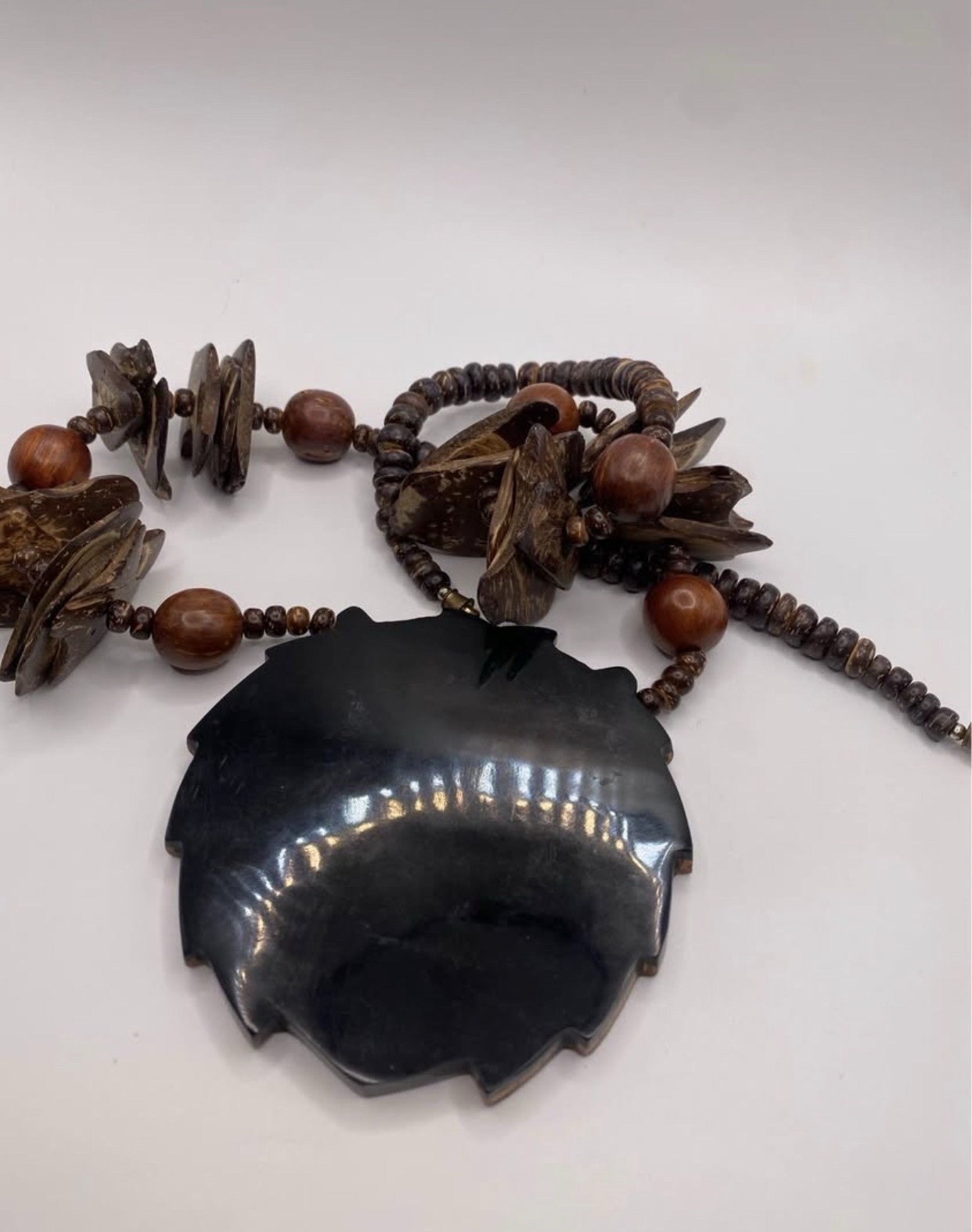 Wood Beaded Necklace by designer Lee Sands . Lion Face Animal Charm Pendant, by