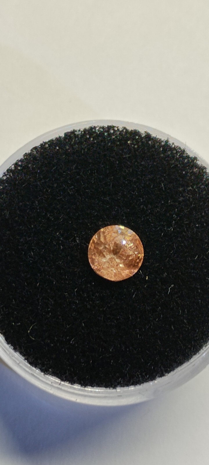 peach schiller faceted Oregon Sunstone 0.80 carat 5.4mm round found & cut in USA