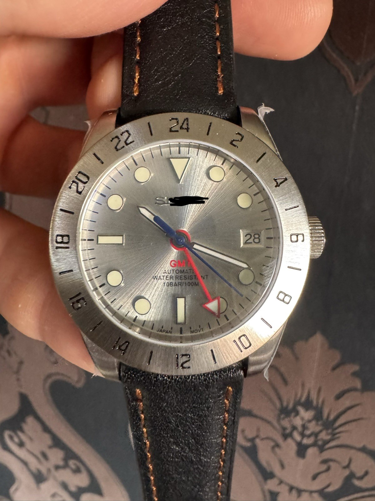 CUSTOM – MOD – GMT watch with S logo and original S NH 34 movement.