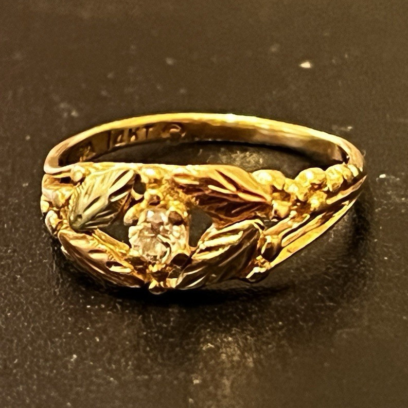 14k Black hills yellow gold ban rose gold and green gold leaflets with diamond.