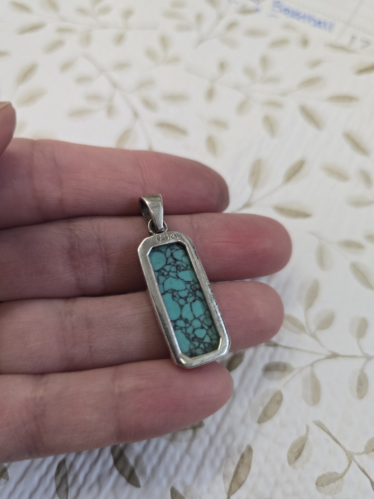 Sterling silver (925) turquoise pendant featuring a rectangular cabochon