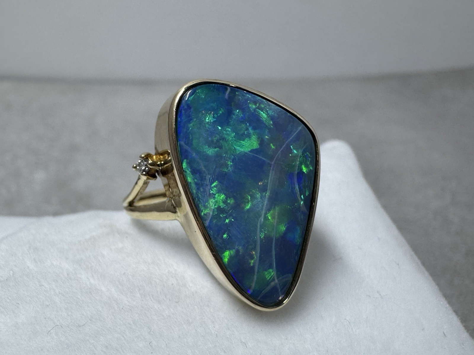 Natural Australian boulder opal with A 14k Gold ring And Diamonds. Ring size 8.
