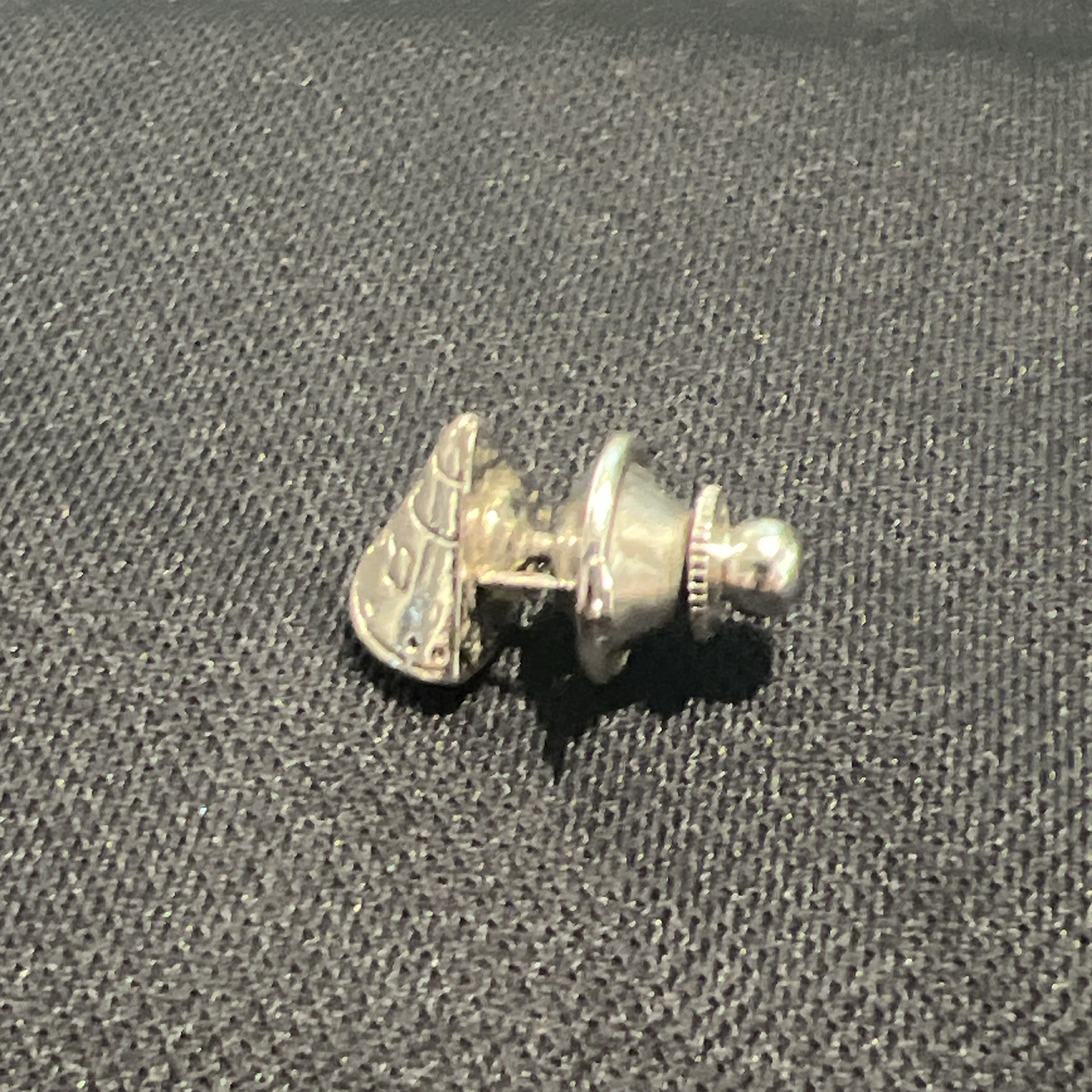 Vintage silver-tone lapel pin or tie tack NASA Apollo-style space capsule