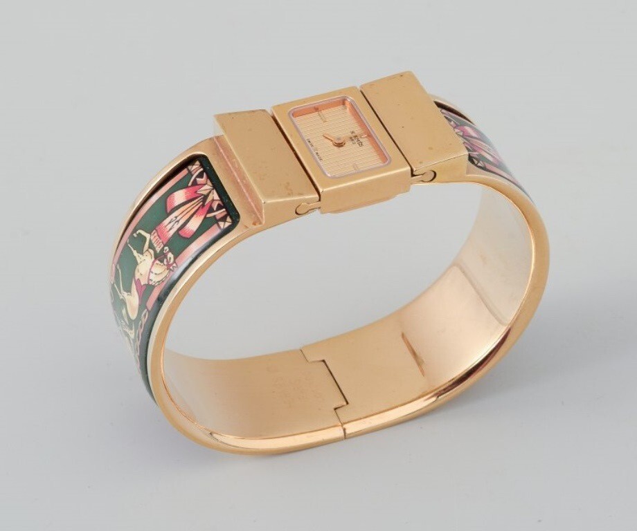 Hermes, ladies’ wristwatch. Made of gilded metal and enamel work.