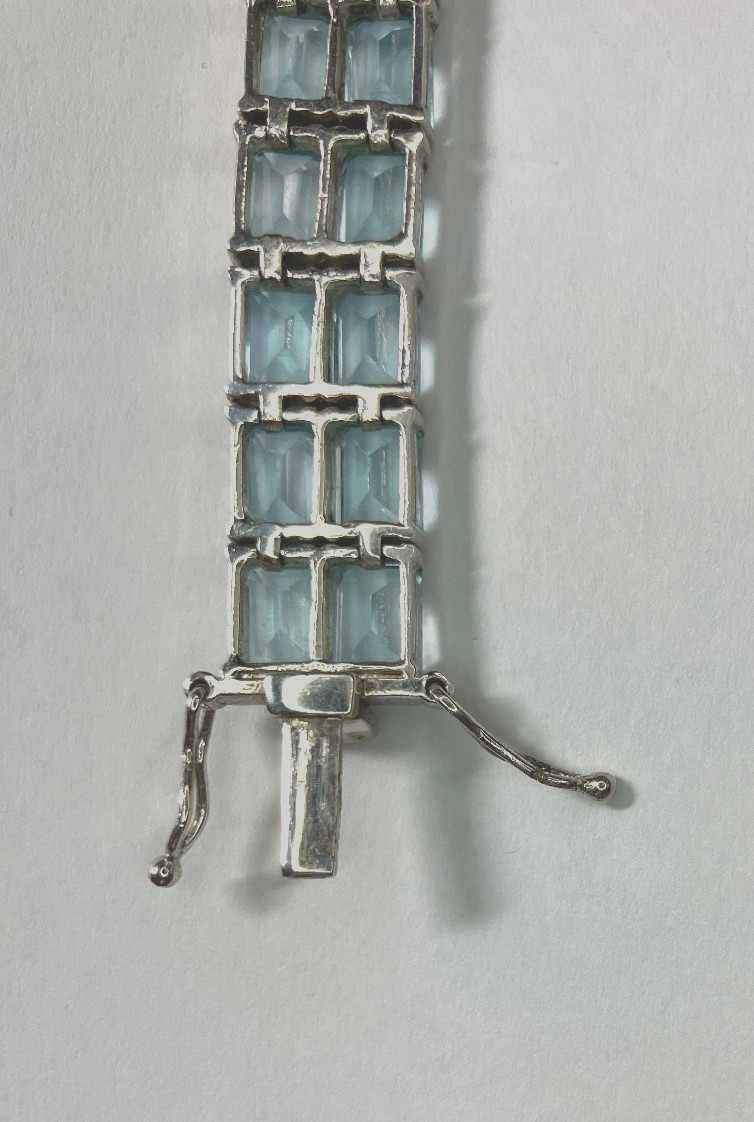 8” TENNIS BRACELET -ADI 925 STERLING SILVER – 40 EMERALD CUT TOPAZ STONES -NICE!