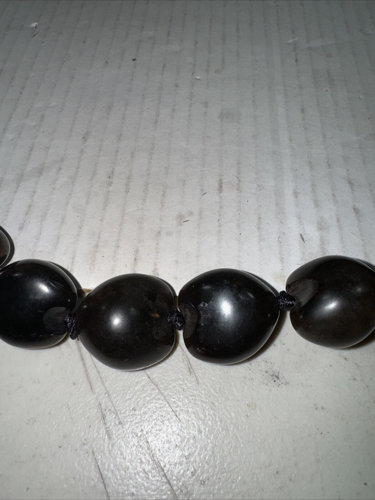 Vintage necklace large dark brown Kukui Nut lei Hawaiiana Black ribbon 12 In.