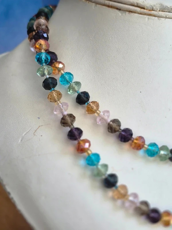 Multi coloured glass cut beads, on long string necklace,