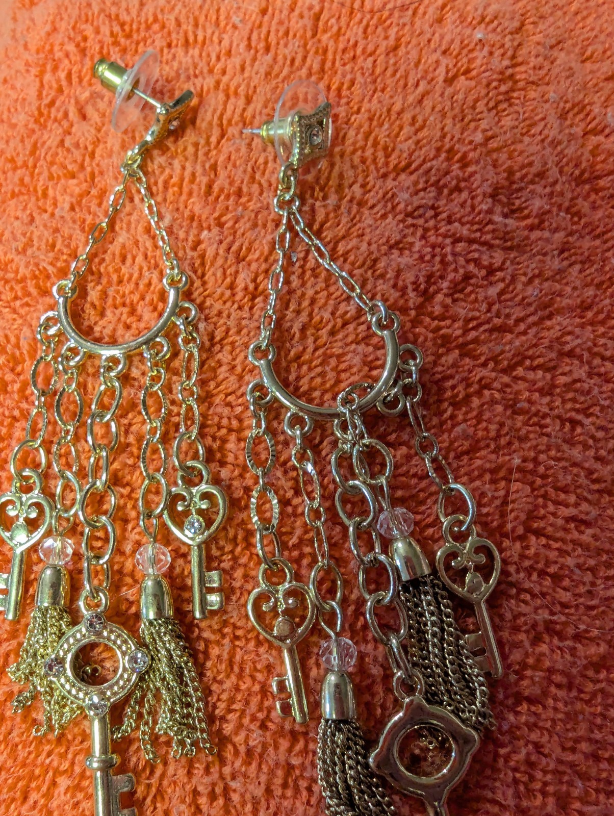 Earrings With Dangling Chains And Various Pendants