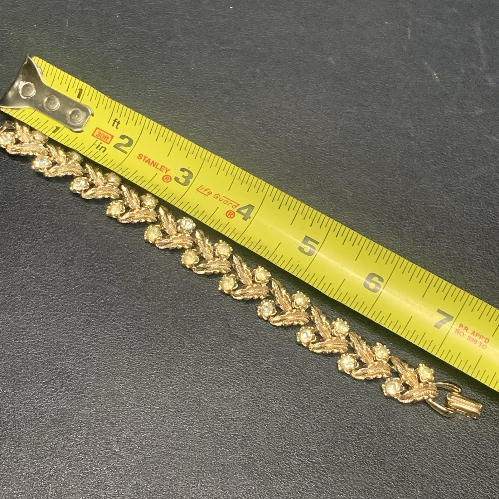 Vintage Coro 7.5” Bracelet Textured Gold Tone Leafs Rhinestones Fold Over Clasp