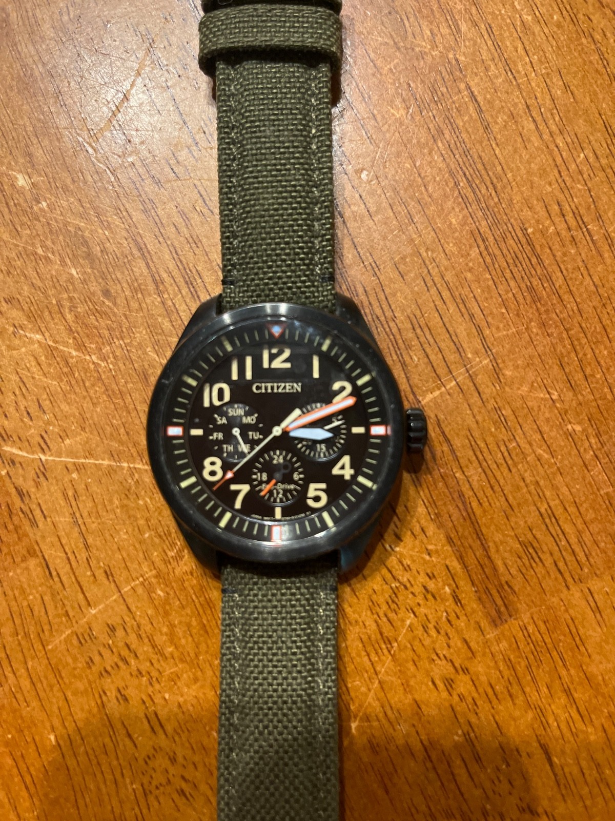 Citizens Watch black face with green nylon band eco drive no battery required