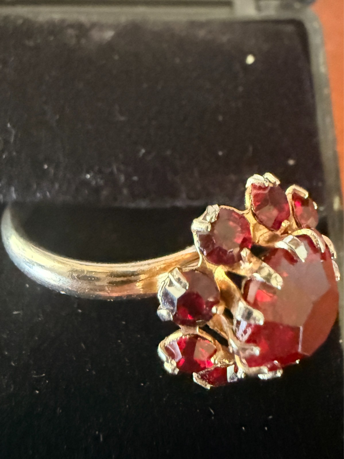 Deep Burgundy ring features a cluster of red rhinestones in a gold-tone setting.