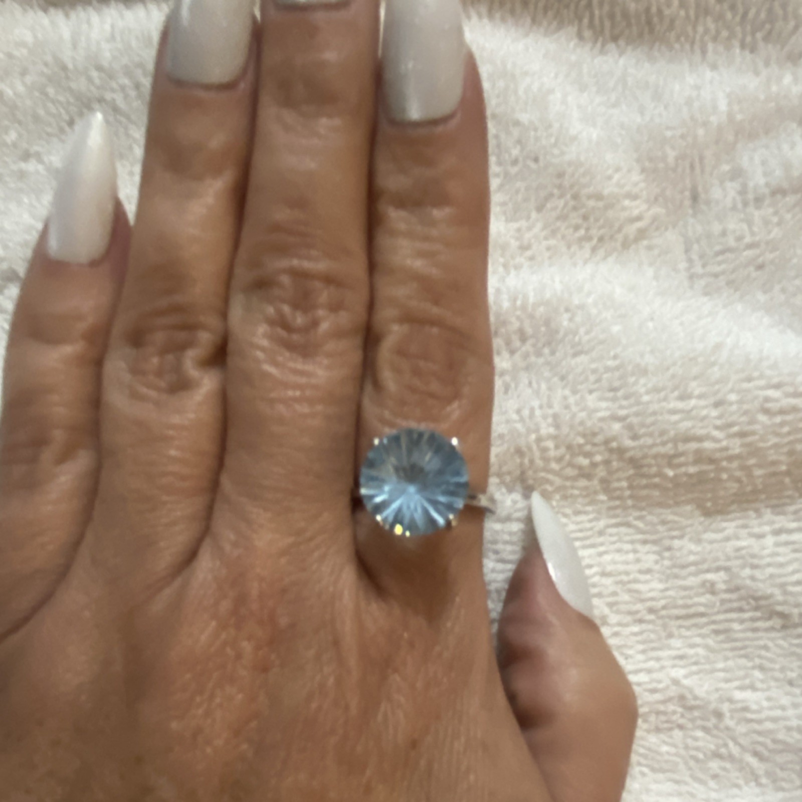 Round blue topaz petal prong, silver tone size 7