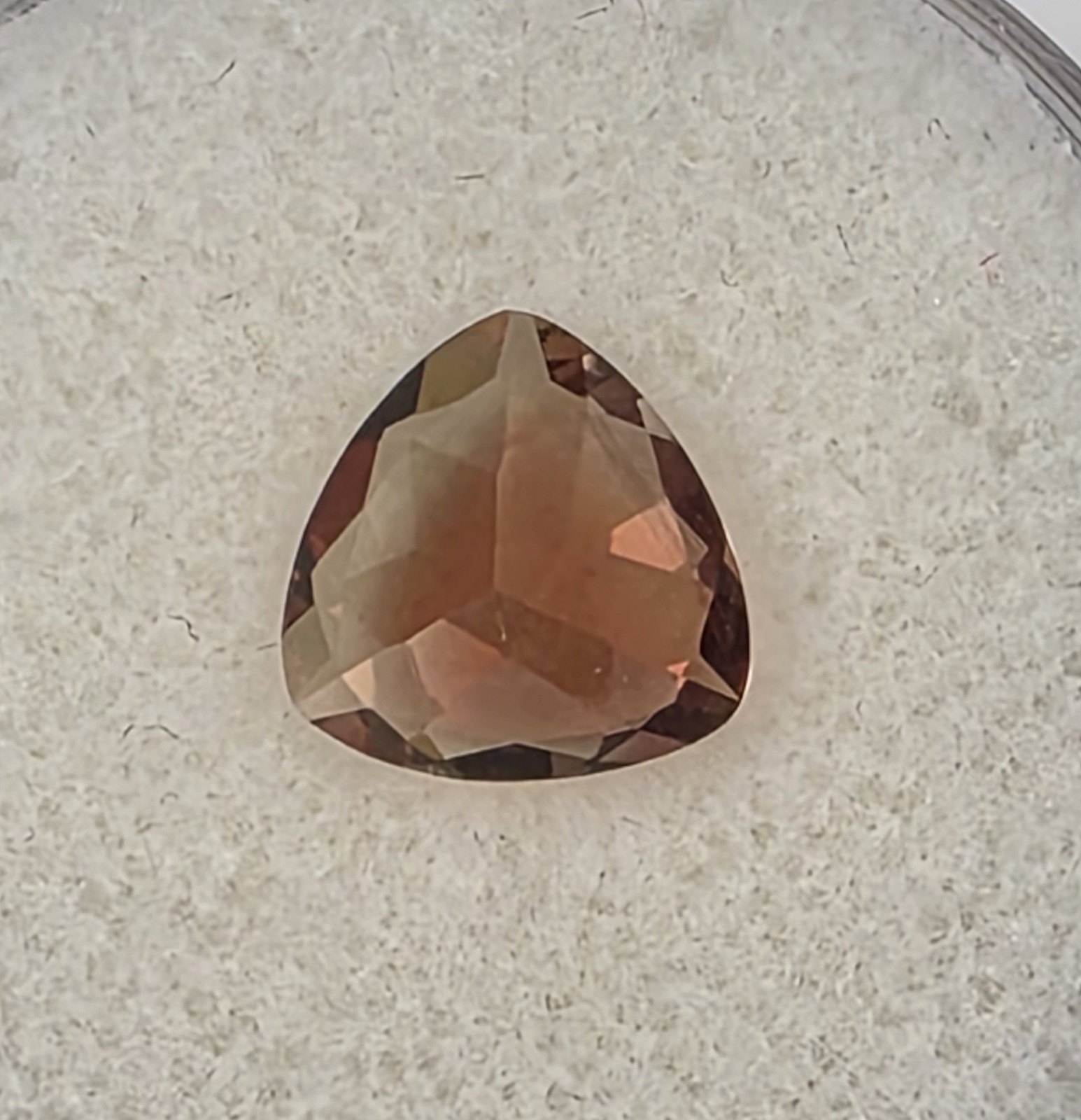 1.72 ct Oregon Sunstone –Trillion Cut – Reddish Orange Color Center Under Table