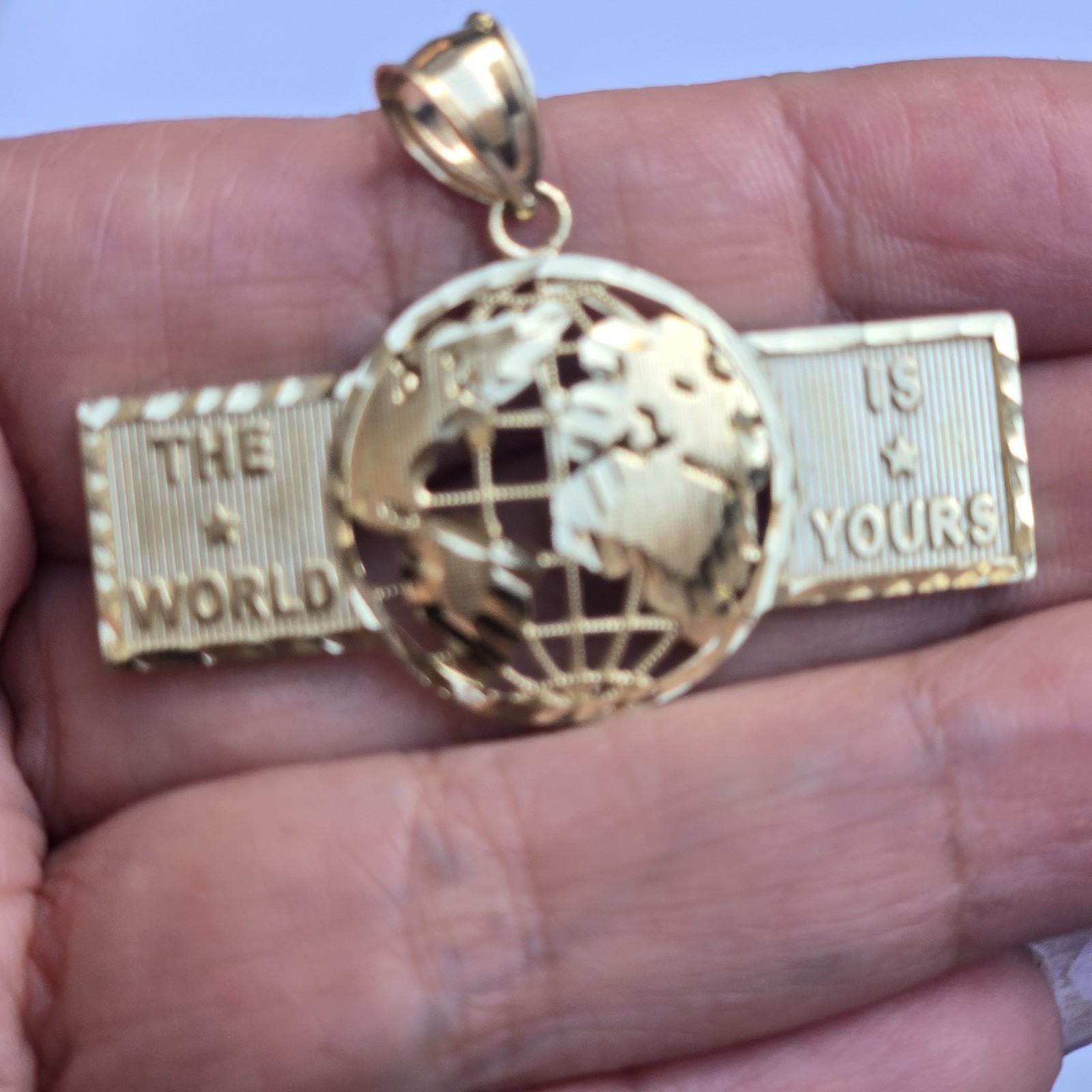 10k Yellow Gold The World Is Yours pendant