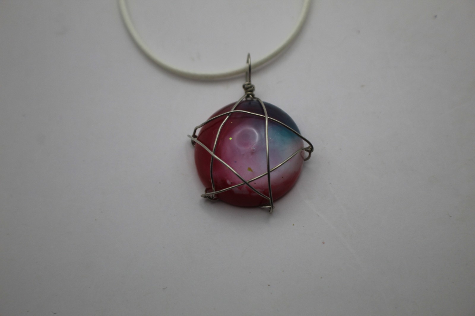 Wire Wrapped Star Resin Pendant On A Cord Necklace