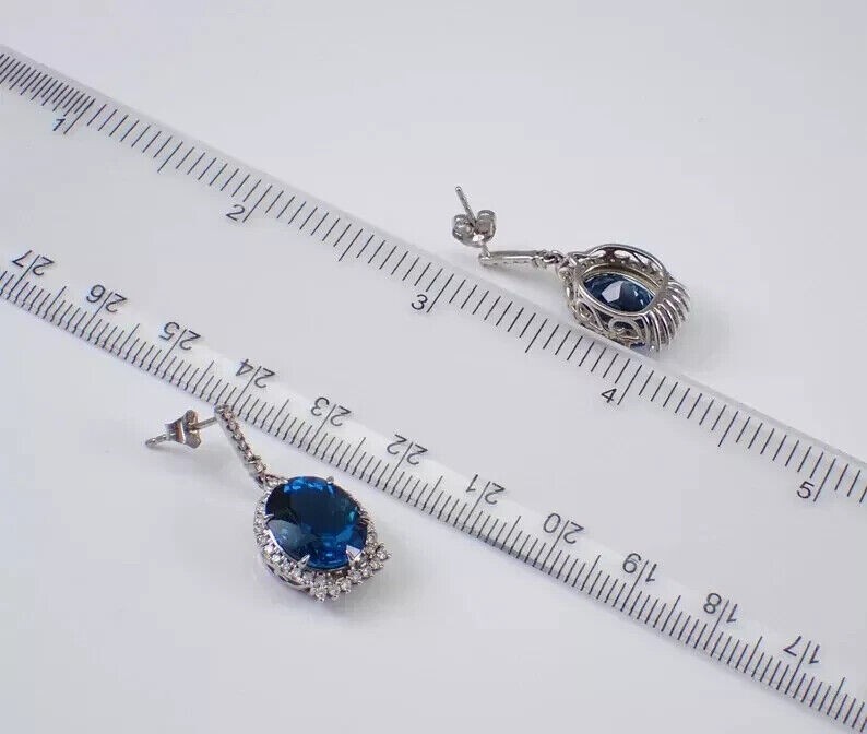 Oval Cut Simulated London Blue Topaz Halo Drop Earrings In 14k White Gold Plated