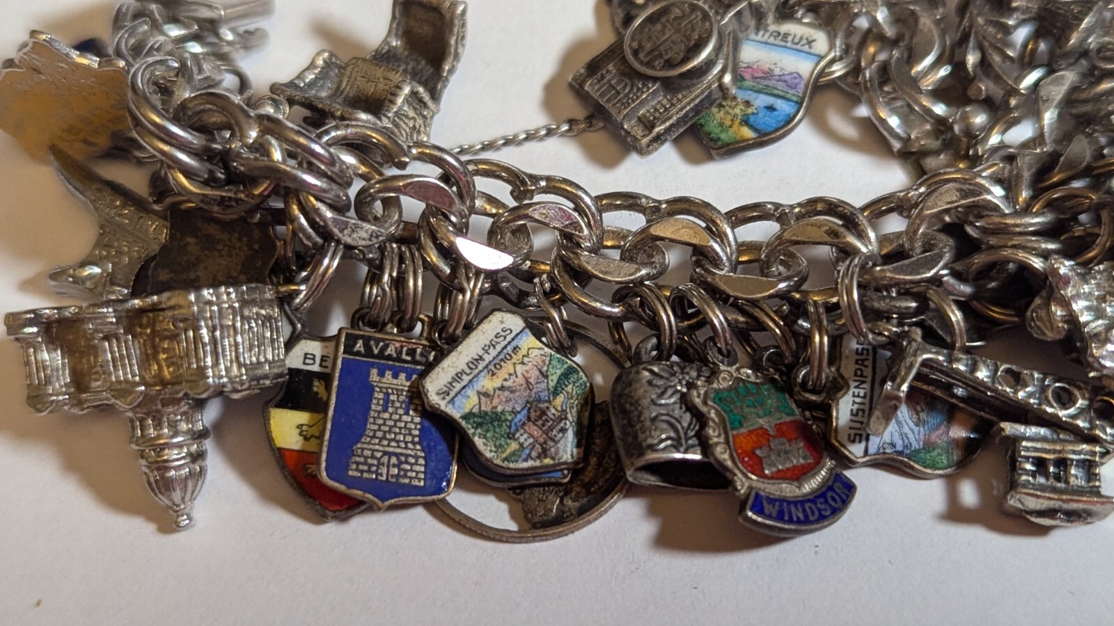 VINTAGE STERLING SILVER CHARM BRACELET WITH ABOUT 35 CHARMS WEIGHS 94.4 GRAMS