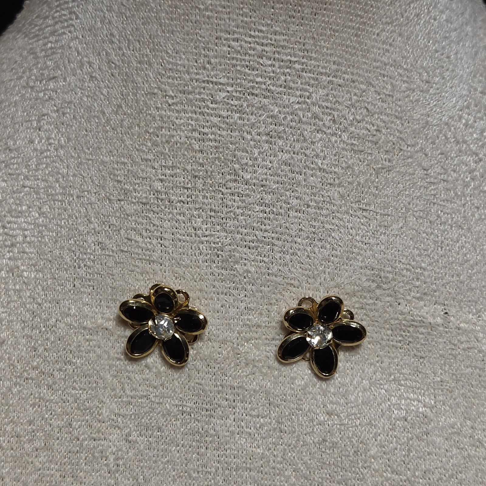 Elegant Gold-tone Floral Earrings With Black Petals And Sparkling Crystal Center