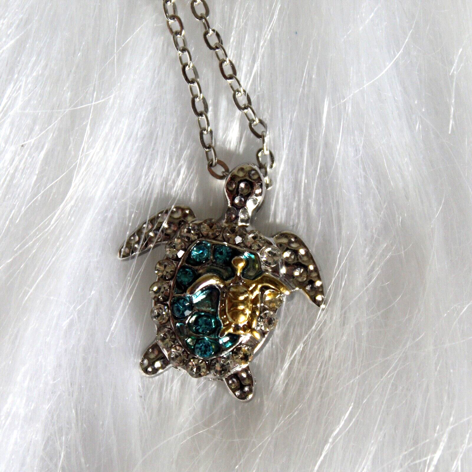 Silver Sea Turtle with Blue Stones and a Gold on an 18″ Silver Chain Mom Baby
