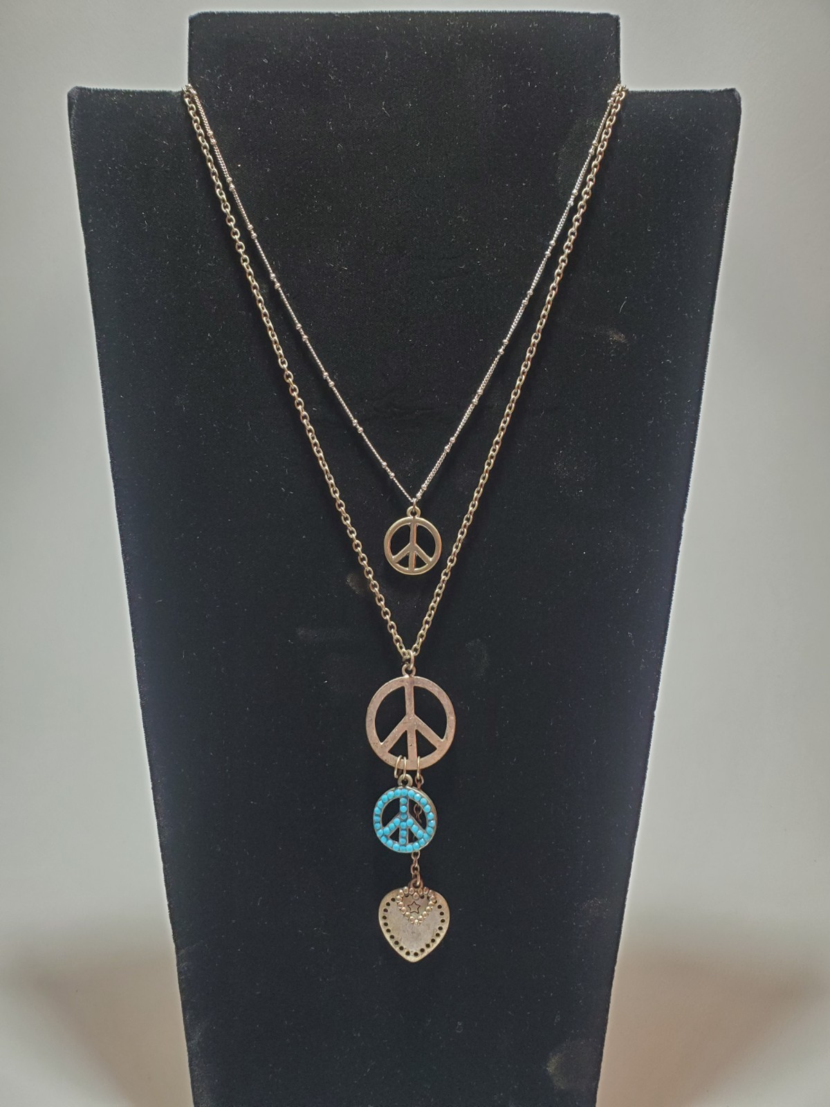 vintage necklace from 60-70’s original hippy days. peace and love signs.