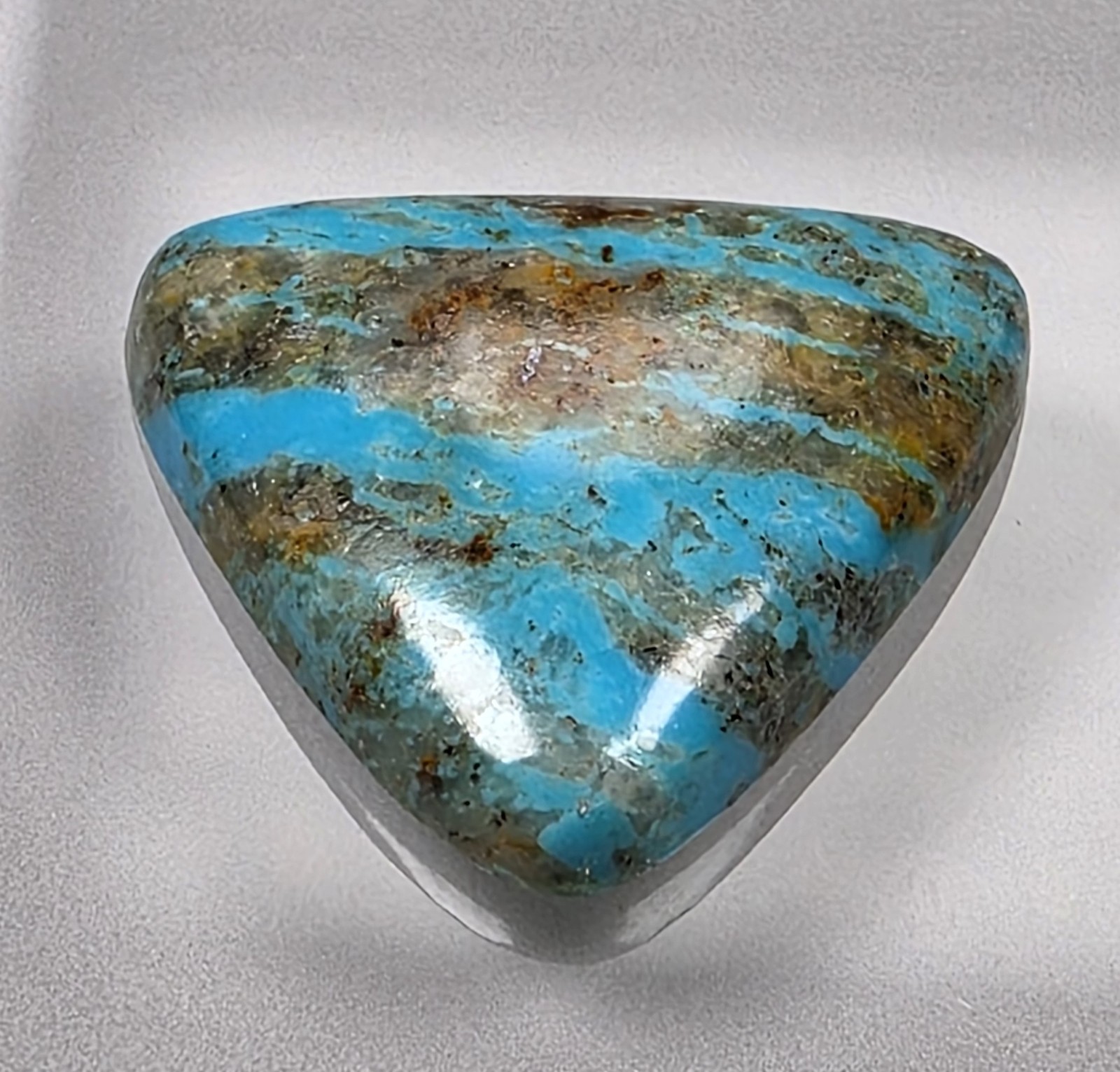 Kingman turquoise cabochon, boulder pattern, trillion cut, 30.49 carats, #B23